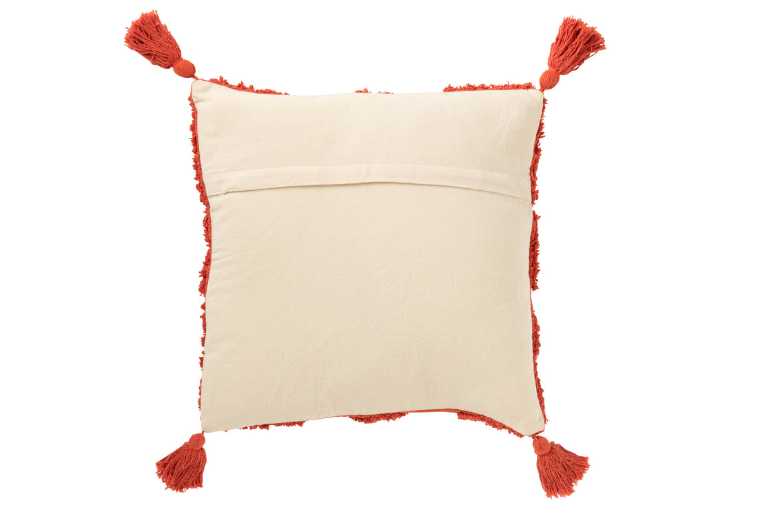 Kussen met knoopsgatenpatroon en kwastjes van katoen in baksteenrood.